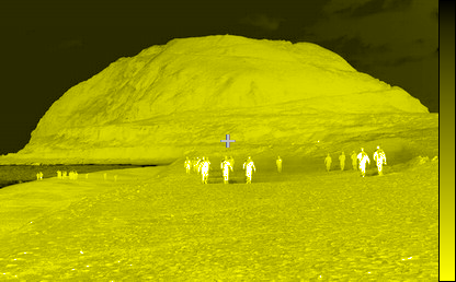 infrared picture of a group of people approaching the mountain