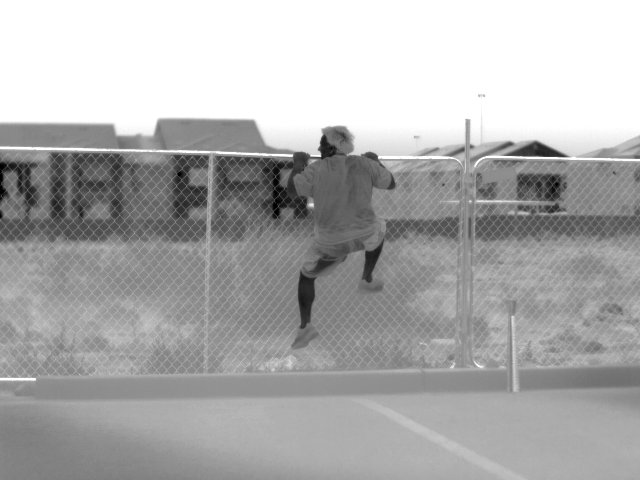Roy Ruiz climbing the fence behind SPI CORP headquarters. 640x480 thermal imaging is the top of the line.