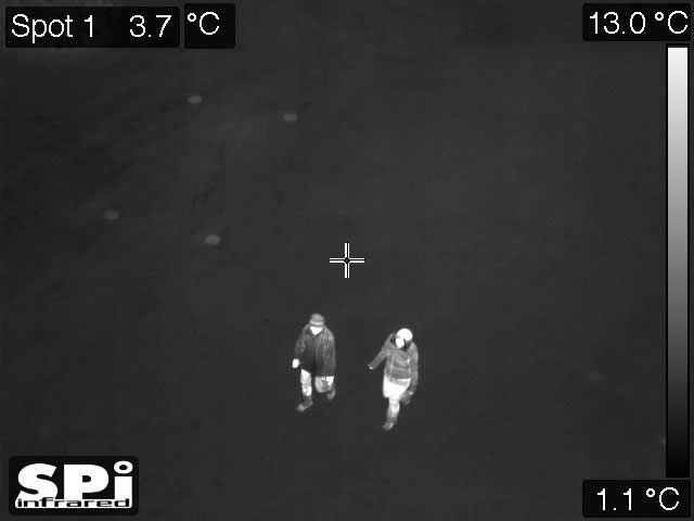 M5 PTZ white hot, monochrome thermal image of two people walking
